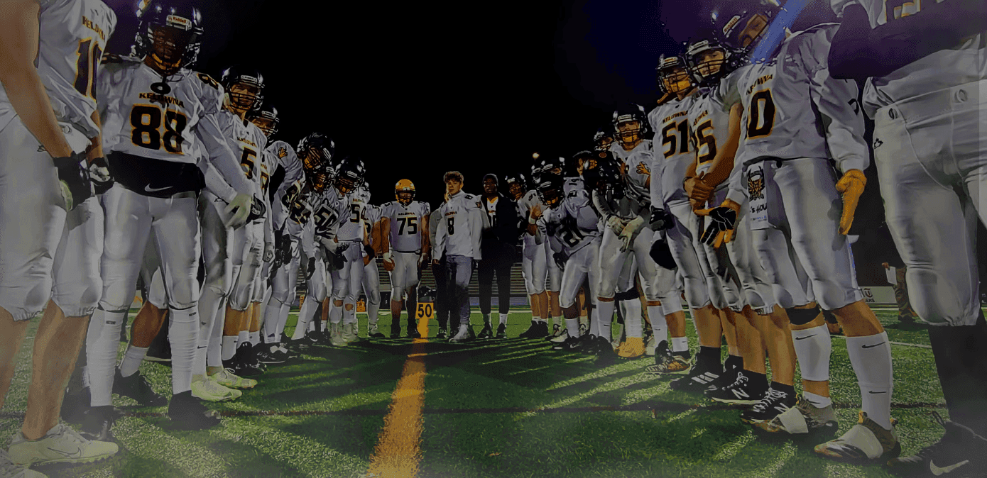 KSS Owls football team huddled on the field